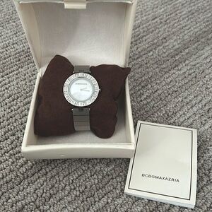 BCBG ladies watch. Genuine diamonds. Never worn, just needs a new battery.